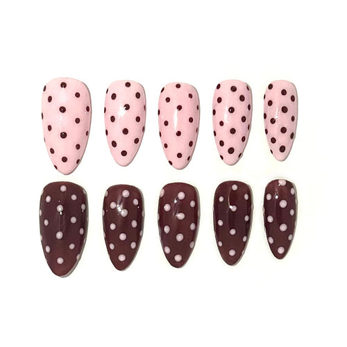 Left hand pink with brown polka dots and right hand brown with pink polka dots. This set is a almond medium.